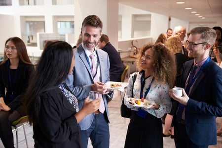 tech conference attendees networking